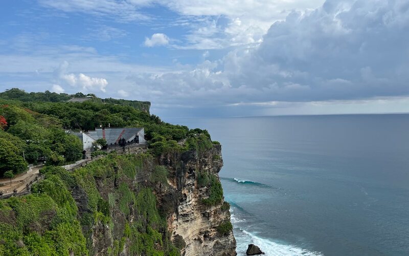 Uluwatu temple on cliff edge at sunset